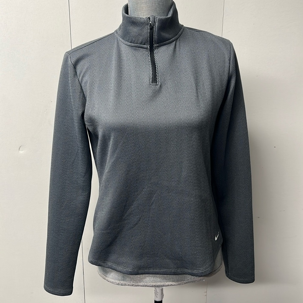 Nike Therma-FIT long sleeve, zip neck athletic shirt.